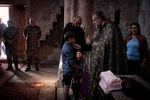 Father Hovhannes Hovhannesyan, abbot of the medieval monastery of Dadivank, performs an impromptu family baptism; anointing the children’s foreheads, palms and knees with chrism. With a minor delay in the handover of Kelbajar from Armenian to Azerbaijani control, thousands of Armenians flocked to Dadivank, one of the most beloved monasteries in all of Karabakh and Armenia, to bid it a final, painful farewell. Though uncertainty still looms over its long-term fate, in that brief window of time, Dadivank stood as a symbol for all that the Armenians had lost; absorbing the communal grief of a nation with each candle lit, and offering something that resembled comfort.  