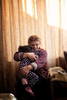 At her home in Nor Noragyugh, Alina Arzumanyan embraces her granddaughter, Elmira, who has just woken up from a nap. Elmira’s parents, a teacher and a gas station attendant, had spent two years and their life savings buying and renovating an apartment in Shushi (Shusha), the final front that was ceded to Azerbaijan. In the weeks before the war, everything seemed to be coming together. They had just moved in and brought their second daughter, Elina, home from the hospital. When the shelling started in Shushi, they left with nothing but a change of clothes for the girls. Now they are faced with the reality that they can never return. 