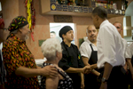 August 9, 2012 - PUEBLO, CO: President Barack Obama greets the staff and owners of Romero's Cafe in Pueblo, Colorado. (Scout Tufankjian for Obama for America/Polaris)