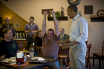 August 14, 2012- KNOXVILLE, IA: Brad Magerkurth, a traveling beer salesman from Minnesota, reacts as President Barack Obama presents him with a bottle of the White house home brewed beer in Knoxville, Iowa.  Magerkurth had stopped by the Coffee Connection in Knoxville while on a business trip and was shocked to find himself discussing beer with the President.  (Scout Tufankjian for Obama for America/Polaris)