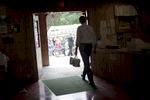 August 18, 2012 - Londonderry, NH: President Barack Obama walks through Mack's Apples in Londonderry, NH after purchasing a few bags of apples.  (Scout Tufankjian for Obama for America/Polaris)
