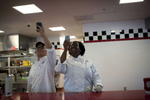 August 21, 2012 - COLUMBUS, OH:  Workers at Sloopy's Diner beam as they photograph President Barack Obama with their cell phones during his visit to Columbus, OH. (Scout Tufankjian for Obama for America/Polaris)