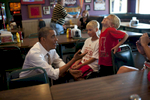 September 1, 2012 - Sioux City, IA: President Barack Obama teases two boys at Bob Roe's Point After sports bar in Sioux City, IA.  (Scout Tufankjian for Obama for America/Polaris)