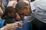September 2, 2012 - Boulder, CO: President Barack Obama greets a young boy after speaking at a campaign event at the University of Colorado Boulder. (Scout Tufankjian for Obama for America/Polaris)