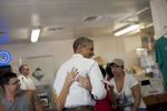 September 8, 2012 - Tampa, FL: A woman at the West Tampa Sandwich Shop and Restaurant in Tampa, FL embraces President Barack Obama during a visit to the shop. (Scout Tufankjian for Obama for America/Polaris)