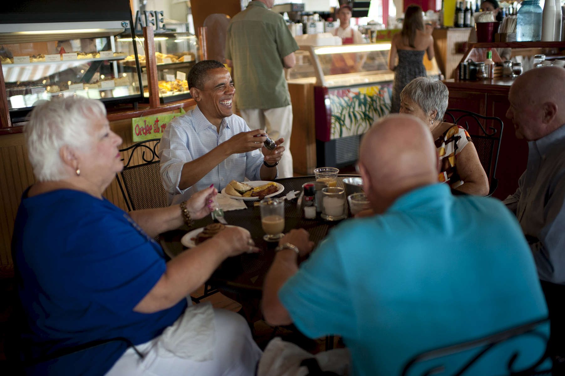 September 9, 2012- Cocoa Village, FL: President Barack Obama has breakfast with a group of senior citizens at Ossorio Bakery & Café in Cocoa Village, FL. (Scout Tufankjian for Obama for America/Polaris)
