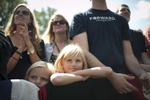 September 13, 2012 - Golden, CO: A family listens as President Barack Obama speaks at a campaign event in Golden, CO. (Scout Tufankjian for Obama for America/Polaris)