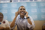 October 1, 2012 - Henderson, NV: President Barack Obama grins as he calls potential supporters from a campaign field office in Henderson, NV. (Scout Tufankjian for Obama for America/Polaris)