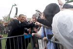 October 5, 2012 - Cleveland, OH- President Barack Obama high-fives a supporter during a rain soaked rally in Cleveland, OH.  (Scout Tufankjian for Obama for America/Polaris)