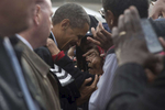 October 5, 2012 - Cleveland, OH- President Barack Obama embraces an elderly supporter after a rain soaked rally in Cleveland, OH.  (Scout Tufankjian for Obama for America/Polaris)