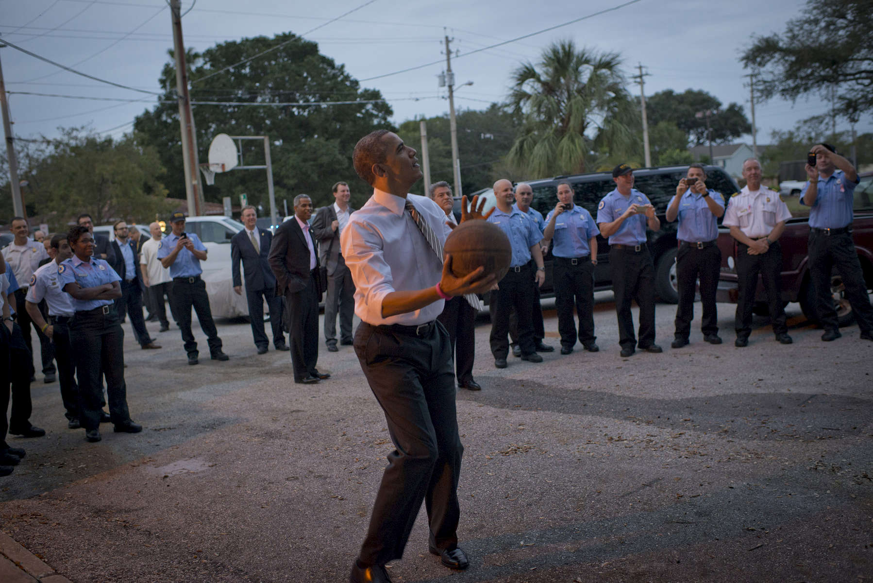 October 25, 2012 - Tampa, FL:  President Barack Obama shoots a basketball during a visit at a Tampa firehouse during a 48 hour straight swing of campaign events. (Scout Tufankjian for Obama for America/Polaris)