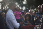 October 25, 2012 - Tampa, FL:  President Barack Obama kisses a small baby after a rally in Tampa's Centennial Park during a 48 hour straight swing of campaign events. (Scout Tufankjian for Obama for America/Polaris)