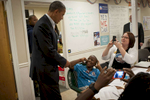 October 28, 2012 - Orlando, FL:  President Barack Obama surprises a young boy who is making phone calls to voters at a campaign field office in Orlando, FL. (Scout Tufankjian for Obama for America/Polaris)