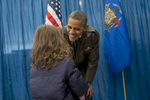 November 1, 2012 - Green Bay, WI: President Barack Obama grins at a little girl backstage after a tarmac rally in Green Bay a few days before the 2012 election.  (Scout Tufankjian for Obama for America/Polaris)