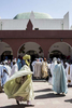 Men wait outside the outer palace to pay respects or lodge complaints with the Emir of Kano, Muhammed Sanusi II in Kano, Nigeria 