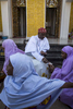 Kano, Nigeria- The Emir of Kano, Muhammed Sanusi II, gives alms (a 10 Naira note and candy) to girls after Friday prayers in Kano, Nigeria on Friday, January 19, 2018.The Emir of Kano is the fourth most powerful religious leader in Nigeria ruling the Kingdom of Kano which has been in existence for over 1000 years. The former Governor of the Central Bank of Nigeria, Muhammed Sanusi II, 56, was crowned in 2014, taking over the traditional role as a religious leader but also as an advisor to politicians, government employees, village chiefs and even settles disputes between individuals.Seen as a modern leader, Sanusi II has been a champion for girls education, women rights, job creation, development as well as the re-industrializing Kano State. But, as his methods of communication became just as advanced by using Facebook and Twitter via his aides, coupled with his radical thoughts on modern islam, many felt that he was being influenced by the west and a backlash began. Since then, the Emir has reduced/eliminated his involvement in social media as well as softened his approach with the conservative scholars. (Photo by Jane Hahn for the Washington Post)