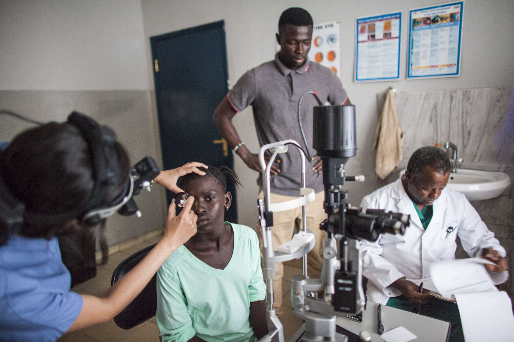 Dr. Jessican Shantha examines the eye of Isatu Tholley, 12, the day after her cataract was removed at the Kissy United Methodist Church Eye Hospital in Freetown, Sierra Leone.