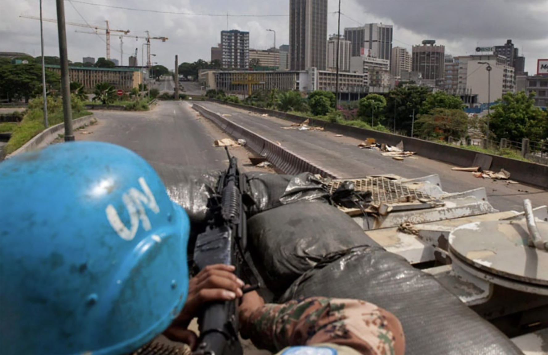 A Jordanian UN peacekeeper keeps watch for snipers while evacuating Lebanese expatriates in Abidjan, Ivory Coast in April 2011. 