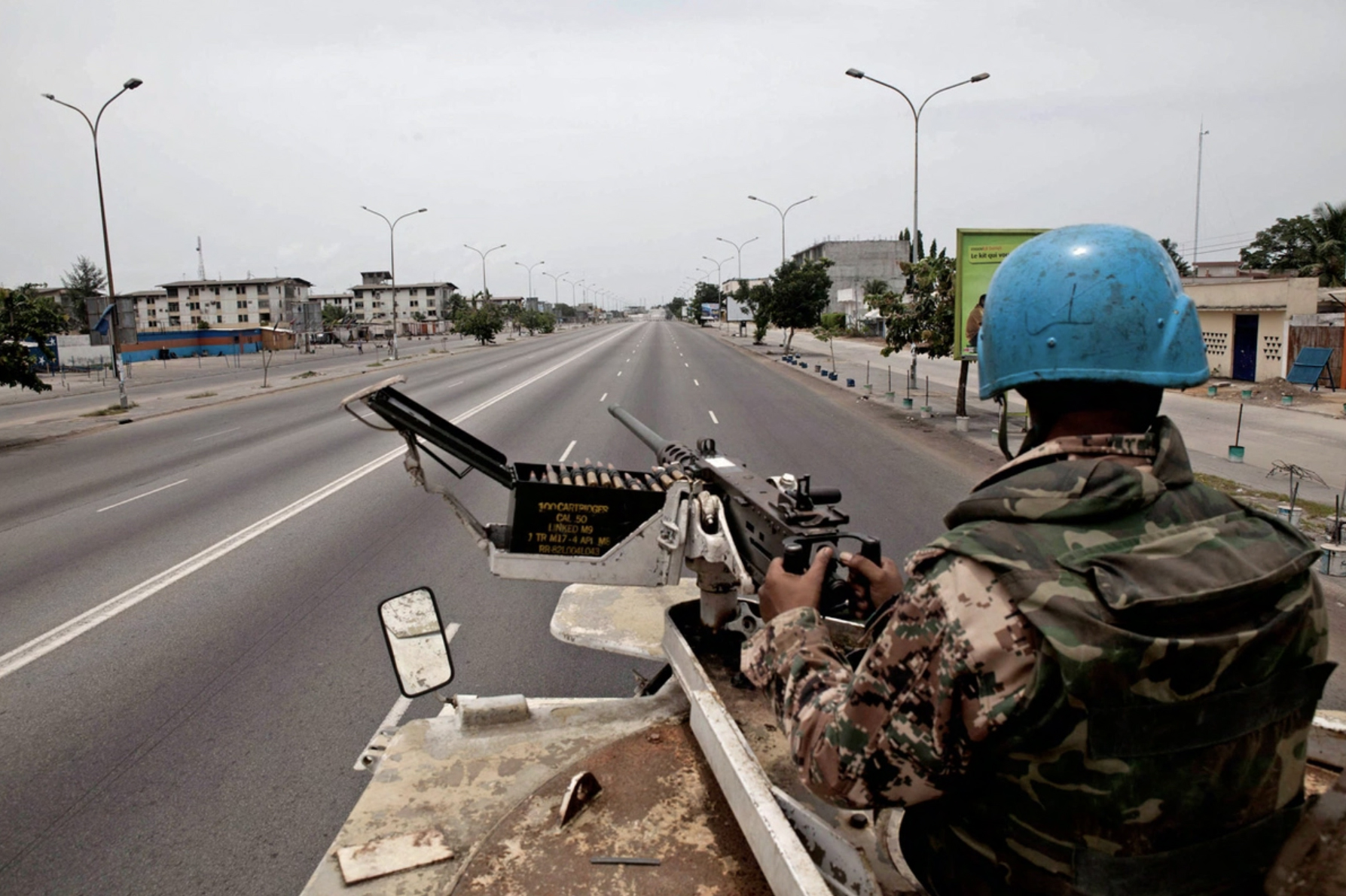 A Jordanian UN peacekeeper keeps watch for snipers while evacuating Lebanese expatriates in Abidjan, Ivory Coast in April 2011. 