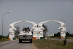 A Jordanian UN Peacekeeping APC passes through the entrance to the airport road in Abidjan, Ivory Coast in April 2011. After months of post election violence and thousands of deaths, Laurent Gbagbo and his wife Simone finally ceded power to Alassane Ouattara with the backing of French and UN forces allied with the FRCI.