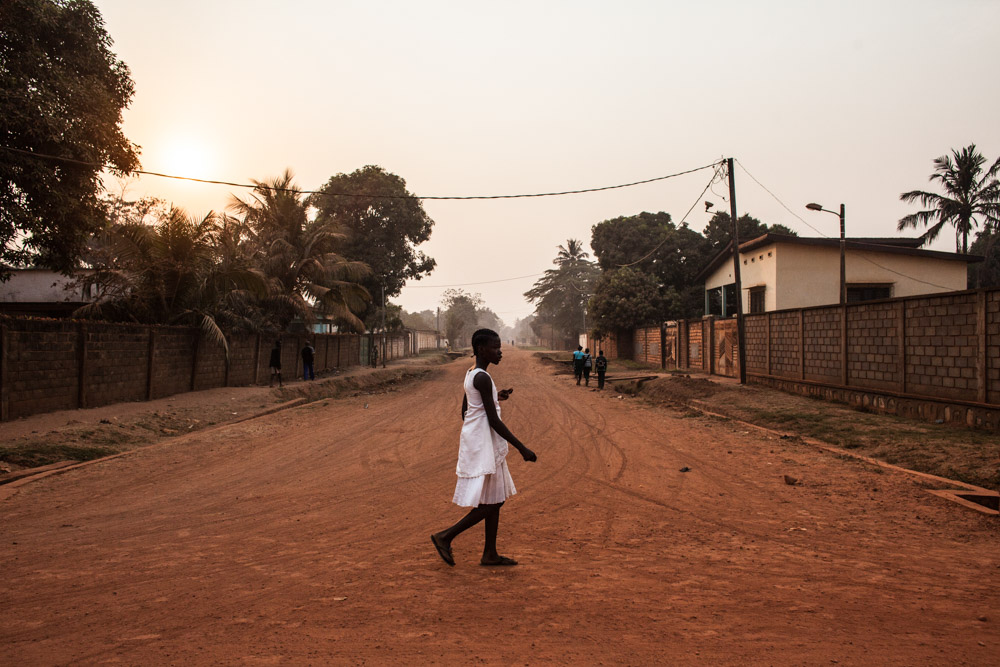 A young girl walks through the Castors neighborhood in Bangui, Central African Republic.