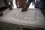San Salvador, El Salvador- General Manager of Grupo Roble, Rafael Menéndez, Vice President of El Salvador, Óscar Ortiz, and President of ANDA (National Administration of Aqueducts and Sewers), Felipe Rivas look over blueprints to the Vista Tower construction site in San Salvador, El Salvador June 2018. (Jane Hahn)