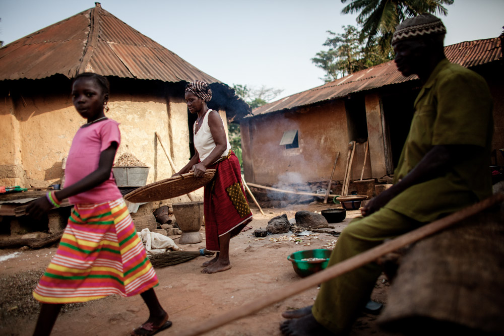 A woman prepares food in Meliandou, Guinea on January 25, 2015. Meliandou is starting point of the Ebola epidemic when toddler Emile Ouamouno was the first to die from the virus in December of 2013. Since then 15 people have died of Ebola in the small village leading 200 people to flee since the start of the epidemic leaving 400 people. What was once a prosperous farming community, most now live in hunger unable to tend to their fields of mainly corn, palm and coffee. 