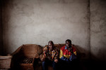 Vövpö Delamou, 67, village elder and Pepe Haba, 39, sits in the Haba home in Womey, Guinea on January 24, 2015. Delamou and Haba recouns the events September 16, 2014 when a government led group visiting Womey was attacked and eight people were killed while trying to educate people about Ebola. The people of Womey claim the military looted all of their belongings while their town was occupied.
