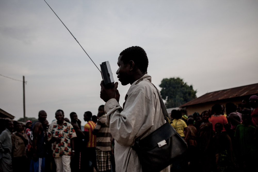 A man listens to the radio in N'zebela, Guinea on January 22, 2015. Most people in the forested region of Guinea receive news through the radio due to high levels of illiteracy. 