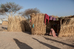 A woman sits outside of her hut in Kindjandi in Diffa, Niger.