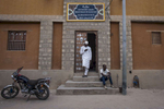 Men stand outside of the Manuscript Library in Timbuktu, Mali on Monday, January 9, 2017.