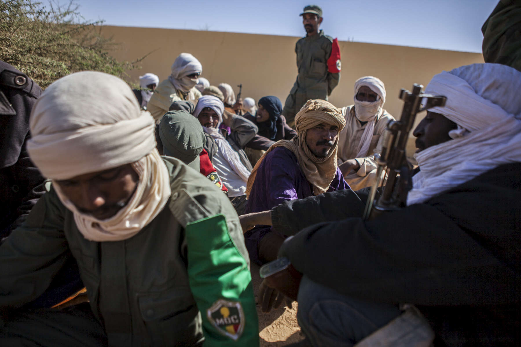 Members of former rebel groups part of the peace process wait to be registered in the MOC at a local police station in Gao, Mali on Friday, January 13, 2017. Close to 150 men wait to be registered in the MOC (Mécanisme Opérationnel de Coordination) but the process has been delayed due to the number of men exceeding the original amount registered as well as demands of insurance and pay by the men. The MOC will be comprised of the Malian military as well as former members of rebel groups who are a part of the peace agreement. Joint patrols will take place in Gao, Timbuktu and Kidal with Gao being the first city to implement these patrols, the first steps in accomplishing the peace process. 