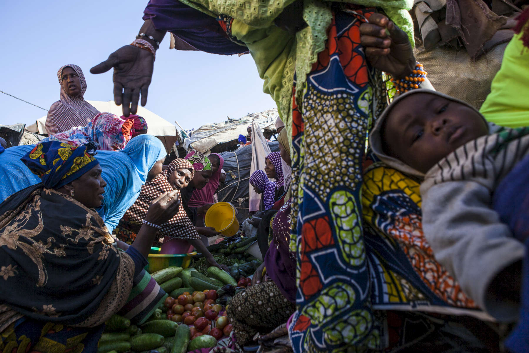 Women buy fresh produce at the market in Gao, Mali on Sunday, January 15, 2017.