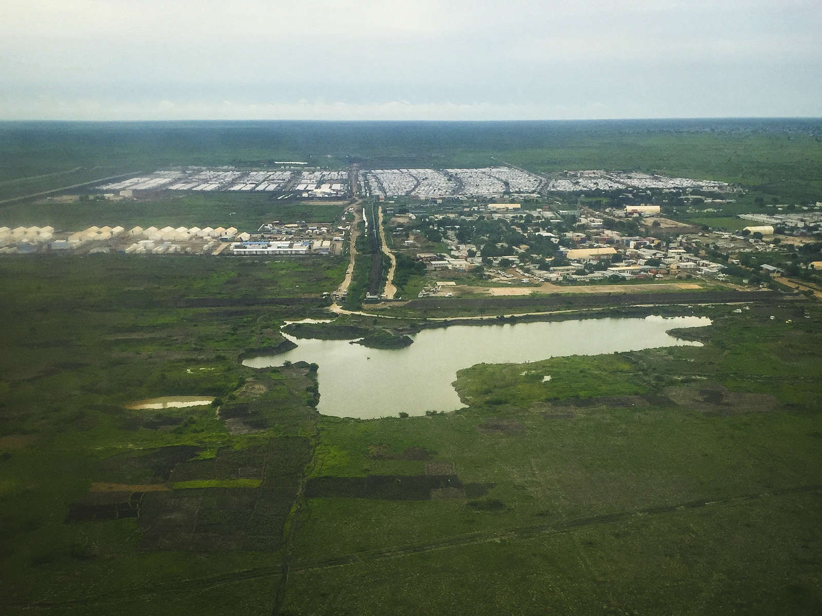 An aerial view of the United Nations Mission in South Sudan base and humanitarian hub (foreground) and the Protection of Civilians (POC) site (background) in Malakal, South Sudan on July 7, 2016. 