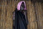 A woman prays at a Pentecostal church in the Protection of Civilians (POC) site at the United Nations Mission in South Sudan (UNMISS) compound in Malakal, South Sudan on Saturday, July 9, 2016. The Malakal POC site houses over 32,000 displaced people mainly from the Shilluk and Nuer tribes. In February of this year, members of the Dinka tribe, who resided in the camp at the time, carried out a coordinated attack within the site leading to the destruction of hundreds of shelters and many deaths. Since then, most members of the Dinka tribe have fled to Malakal town where they occupy the homes of those still displaced. 