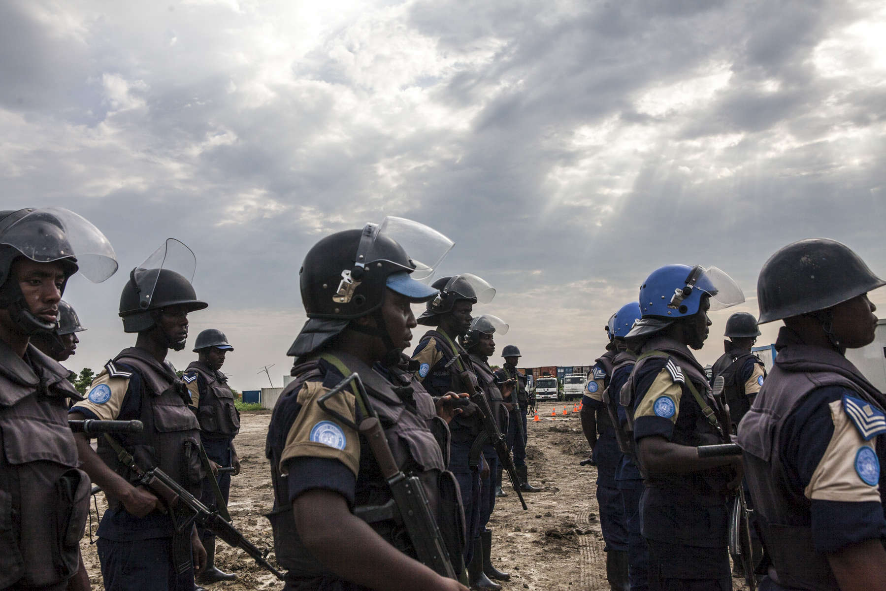 Members of the United Nations Police prepare to search the Protection of Civilians (POC) site of contraband at the United Nations Mission in South Sudan (UNMISS) compound in Malakal, South Sudan on Friday, July 15, 2016. The Malakal POC site houses over 32,000 displaced people mainly from the Shilluk and Nuer tribes. In February of this year, members of the Dinka tribe, who resided in the camp at the time, carried out a coordinated attack within the site leading to the destruction of hundreds of shelters and many deaths. Since then, most members of the Dinka tribe have fled to Malakal town where they occupy the homes of those still displaced. The UN has assured the displaced people that increased security measures around the camp will protect them from any further attack. Most of the displace are not convinced. 