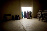 Men wait for a food distribution in Dalli, Niger