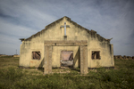 Barkin Ladi, Jos, Nigeria- The remains of a church in Garwaza Village in Barkin Ladi, Nigeria. Villagers were warned of the attack by Fulani members of their community before the attacked on June 23, 2018 by masked gunmen speaking in Hausa, leading many in the community to believe that they were Fulani. Most of the 2000 villagers fled to neighboring Tenti-Babba town where they remain displaced.Over one thousand people have lost their lives this year due to an ongoing conflict between farmers and herders. The current crisis reflects the country's woes from over-population, poverty and climate change to religious division and ethnic favoritism. Growing animosity between ethnic groups coupled with a lack of security  has fomented this increase in violence in recent years. Despite the divisive chaos engulfing the Middle Belt of Nigeria, a group of multi-ethnic men and women, part of the Vigilante Group of Nigeria, are providing much needed security and trust to all groups affected by the conflict.
