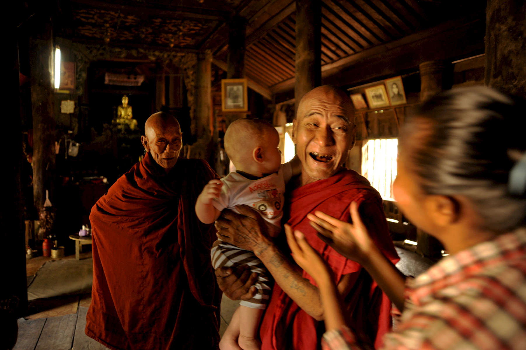 Burmese monks in Tingaza Kyaung, an old wooden monastery located southwest of Mandalay, Myanmar 2009