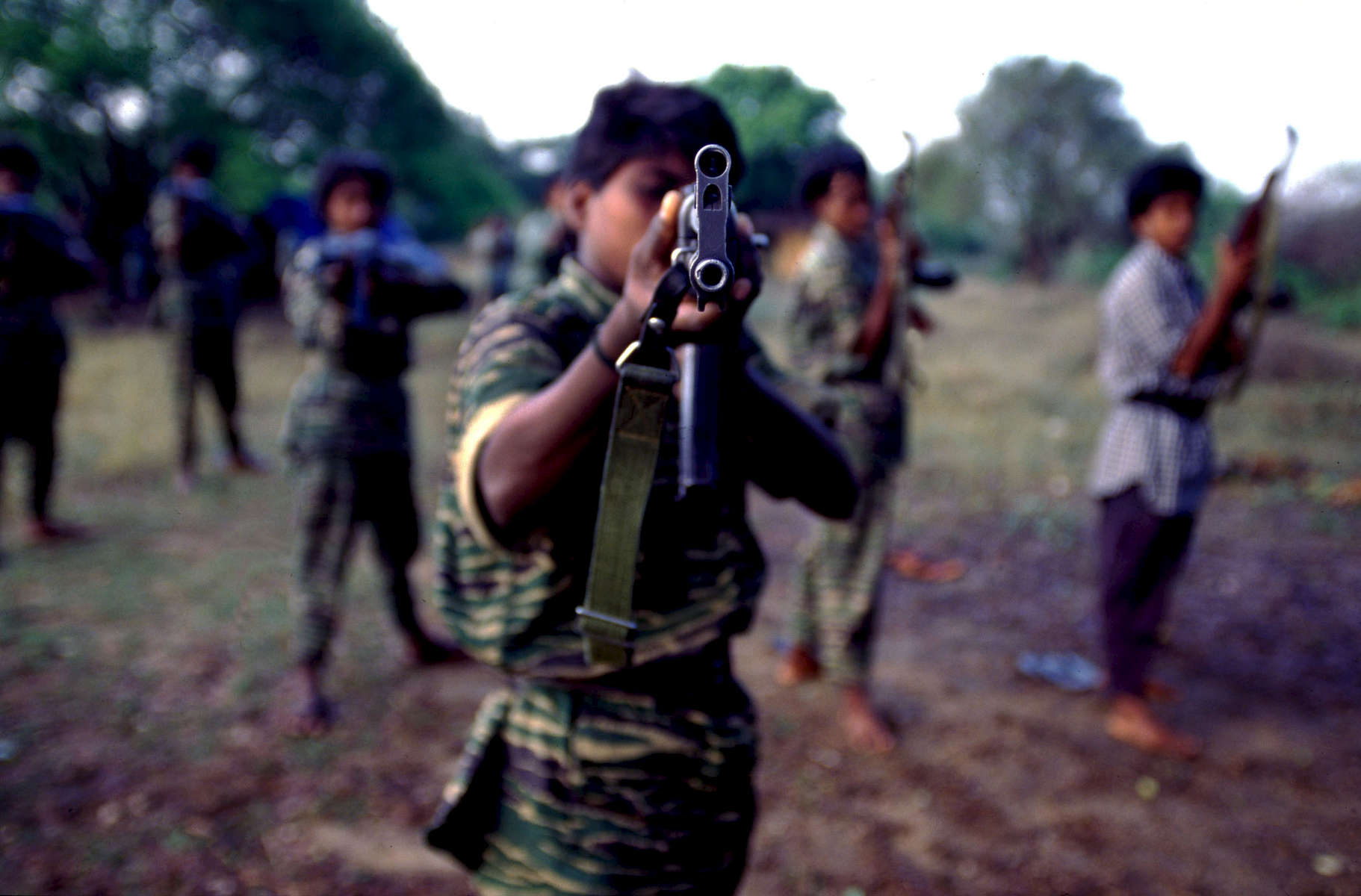 Female Tamil Tiger fighter during small arms training in the northern Vanni region in Sri Lanka. In 1984, eligible female fighters were assembled in the jungles of Tamil Nadu, India, for training, and  from 1987 to 1995 on Jaffna Peninsula. Their first involvement in battle took place in October '86 in the Mannar region. Since the mid eighties, their military training and involvement has evolved into a highly sophisticated autonomous military unit of the Liberation Tigers of Tamil Eelam (LTTE). 1998