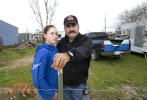 Elmer Hibbar, 51, and his daughter Willow, 14, on their farm property near Orland, California. Hibbar, who is on a fixed disability income, says it is becoming harder and harder to make ends meet. {quote}The dollar just doesn't go as far as it use to.{quote}