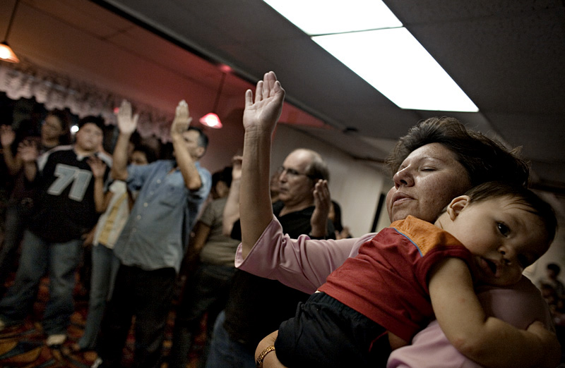 Worshippers send up prayers at the Four Winds Gospel Fellowship.