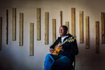 Legendary jazz guitarist Mac McKenzie is often credited with the re-emergence of goema, the unique music of Cape Town City. He is photographed in the bedroom of his home outside of Cape Town, South Africa in 2009.Photograph by Jesse Neider