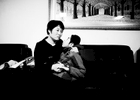 Beijing, March 11, 2015 : Tian Peng, 15, is taken care of by his mother Cui Xinying while his little brother Tian Ye, 3, plays in the apartment.As a baby Tian Peng fell ill with brain   hemorrhage supposedly due to a lack of vitamin K. When Tian Peng was a kid, friends advised the parents to simply abandon him as there\'s neither enough help nor support in China apart from a small NGO. Tian is unable to speak, think, walk and needs help for everything.Chinese attitudes towards people with disabilities have improved in recent years, but the support of society and opportunities in education and employment are scarce.