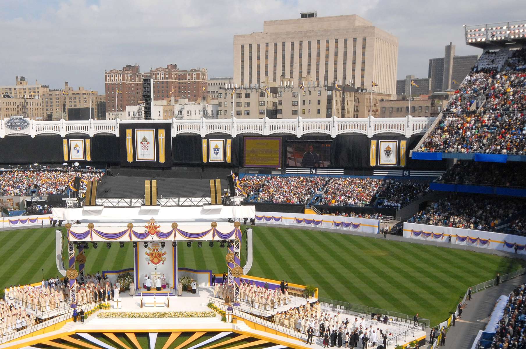 Pope Benedict XVI celebrates mass at Yankees Stadium. Bronx Supreme Court in background.042108