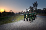 PLA fighters run five kilometers along the main highway in Kilali every morning.
