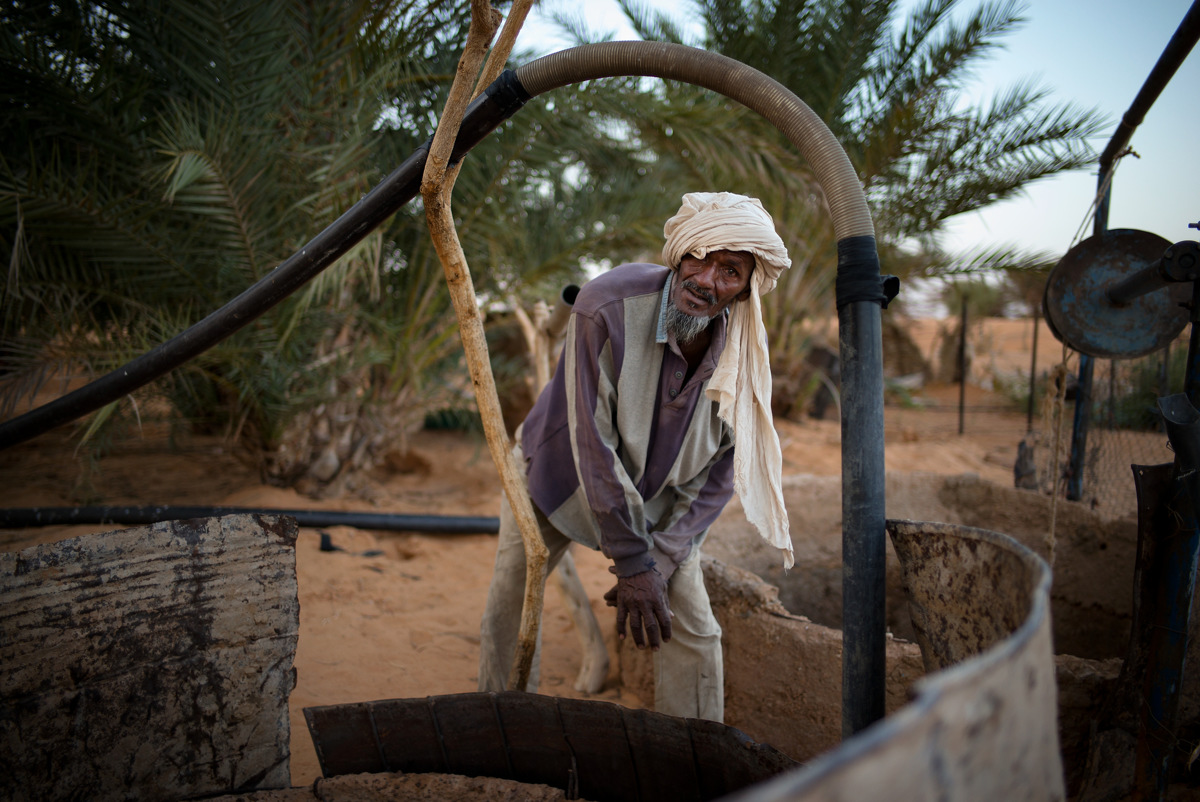 Jeidu fetches water from the well in Lhueeb, nomad camp in outskirts of Chinguetti.