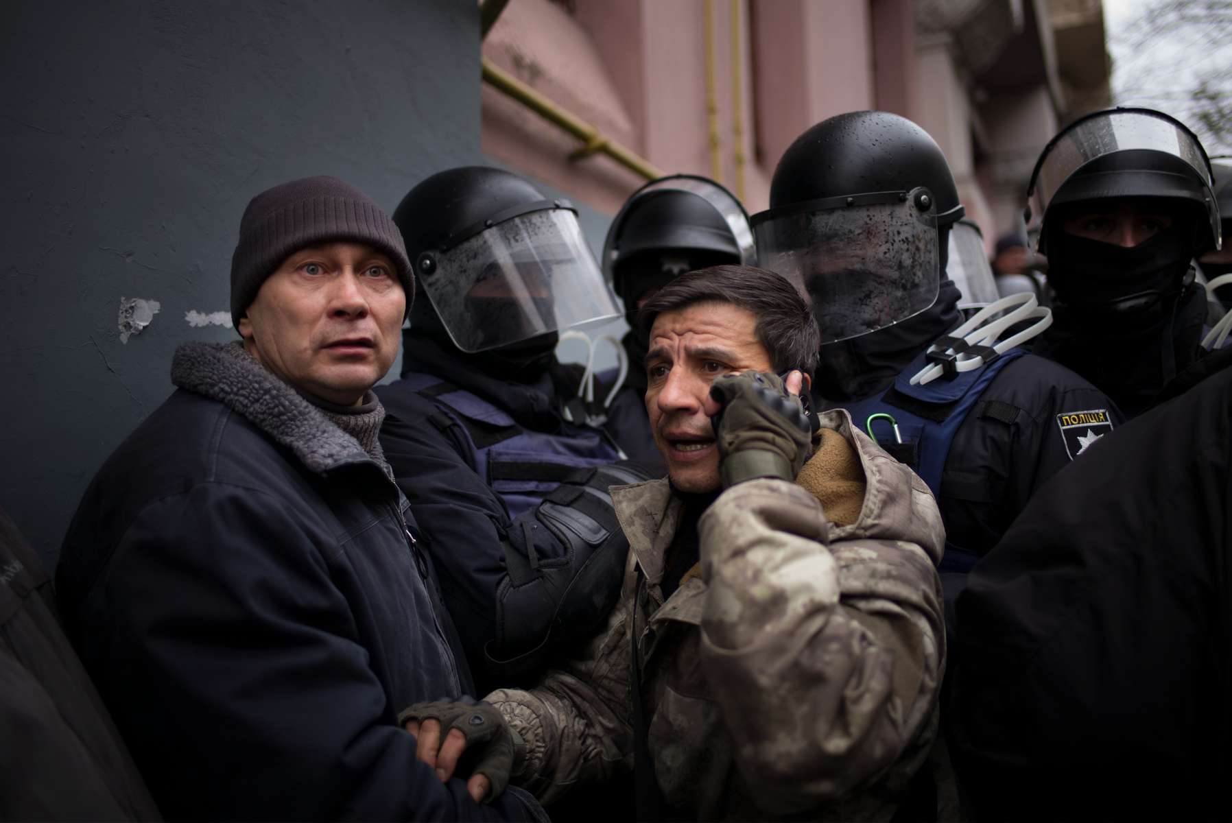 Supporters of former Georgian president clash with police as they attempts to block the police van in which he is transported after being arrested, in downtown Kiev on December 5, 2017. Ukrainian security services on Tuesday arrested former Georgian president Mikheil Saakashvili after he climbed onto the roof of his apartment building and addressed supporters during a police raid. The Ukrainian Security Service (SBU) said Saakashvili had been arrested on charges of assisting criminal organizations.Saakashvili left Georgia in 2013 after serving as president for nearly a decade, and later was appointed governor of Ukraine’s Odessa region. But he quit in 2016, complaining that his efforts to root out corruption were suffering from official obstruction.His Ukrainian citizenship was revoked this year while he was out of the country, but he returned in September after supporters broke through a police line at the Polish border.