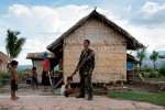 Member of the CAFGU paramilitary in front of his house in Datu Hoffer, Maguindanao.