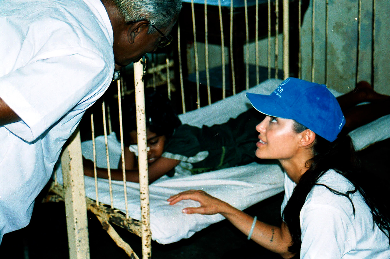 Hollywood actress Angelina Jolie, UNHCR’s good will ambassador talks to the doctor while on the bed side of the injured girl at the pediatrics ward of Valvetithurai hospital in Northern Sri Lankan district of Jaffna. Valvetithurai hospital is catering more than 20,000 people of the District with only one doctor and no maternity ward.  Donation made by Angelina Jolie during her visit enabled hospital to rebuilt pediatrics ward and labor room.